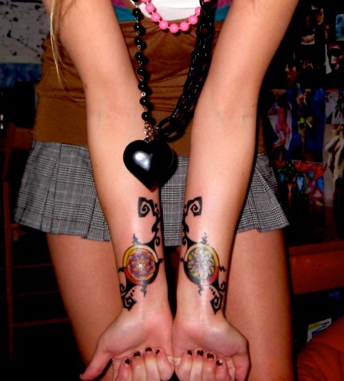 Girl Showing Her Dreamcatcher Tattoos On Both Wrists